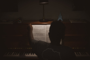 boy playing piano